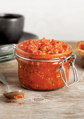 Red salsa in a glass jar